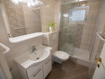 yellow apartment, modern bathroom, shower